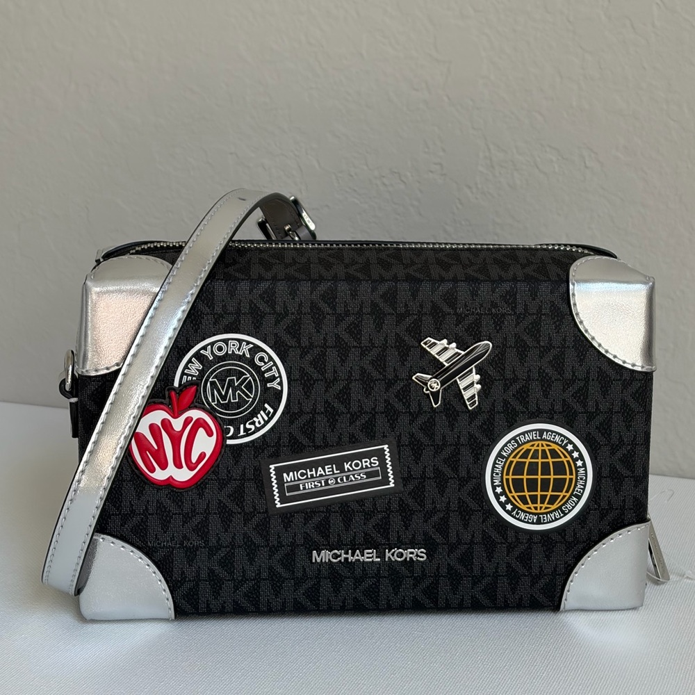 Michael Kors Jeanie Small EW Trunk Crossbody Travel Agency MK Logo Black/Silver - Picture 2 of 16